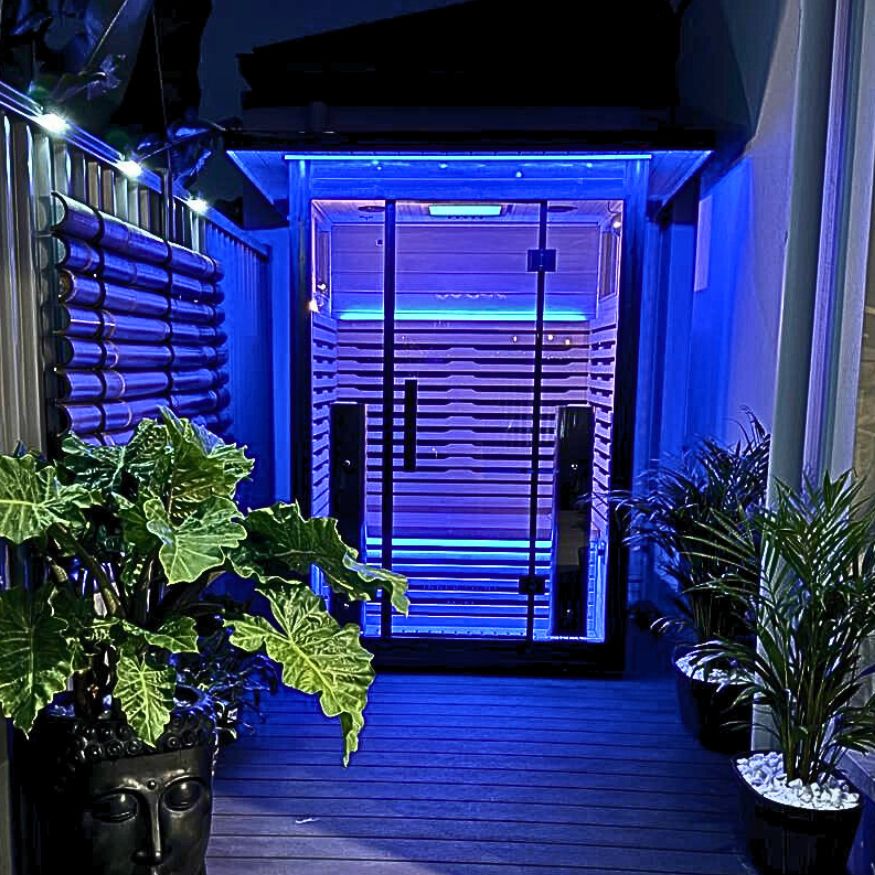 Outdoor Sauna at night on deck blue lights